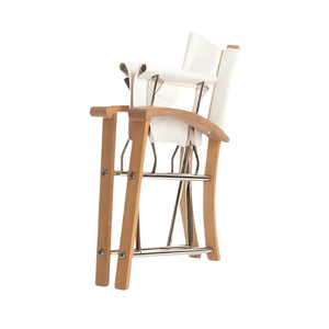 Two Sundeck Director's Chairs with light wood frames, white seats and backs, and marine-grade stainless-steel footrests are stacked together against a white background.