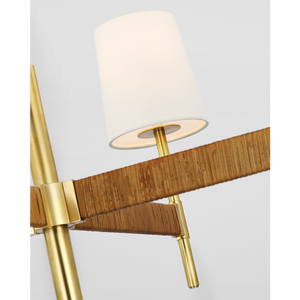 Close-up of a modern lamp with a white cylindrical shade and antique brass-colored metal frame, mounted on a wooden bracket, Elle Large Chandelier, Brass.