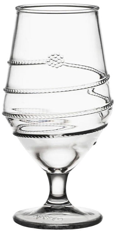 The Juliska Amalia Acrylic Collection features a clear glass with an elegant spiral design on the exterior, resting on a round base, providing a touch of practical indulgence for everyday use.