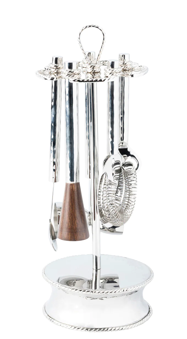 A set of modern silhouette silver kitchen utensils on a stand from the Juliska Graham Barware Collection.