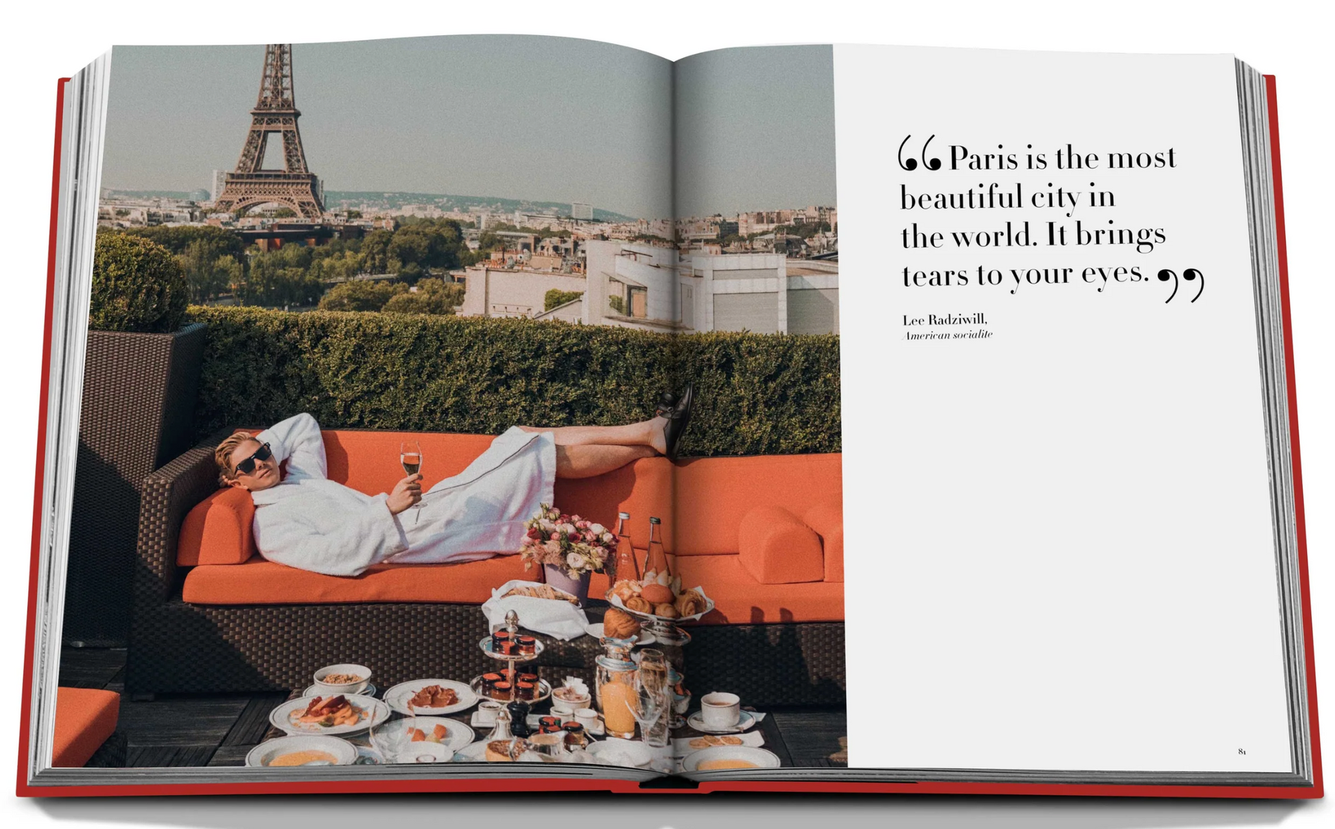 An open book shows a man in a robe lounging on a patio at Plaza Athenee with a view of the Eiffel Tower, surrounded by a spread of food and drinks prepared by Jean Imbert. Text reads, "Paris is the most beautiful city in the world. -Lou Radziwill.