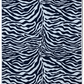 The Matouk Santiago Beach Towel, featuring a chic black and white zebra animal print pattern, is displayed with one corner folded over to reveal its ultra-absorbent terry fabric.