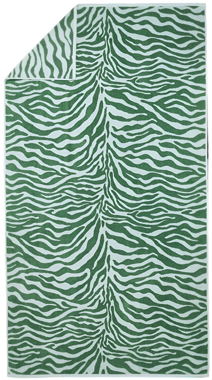 The Matouk Santiago Beach Towel Collection features a green and white zebra stripe patterned towel with an absorbent Terry reverse, showcasing a chic folded corner.