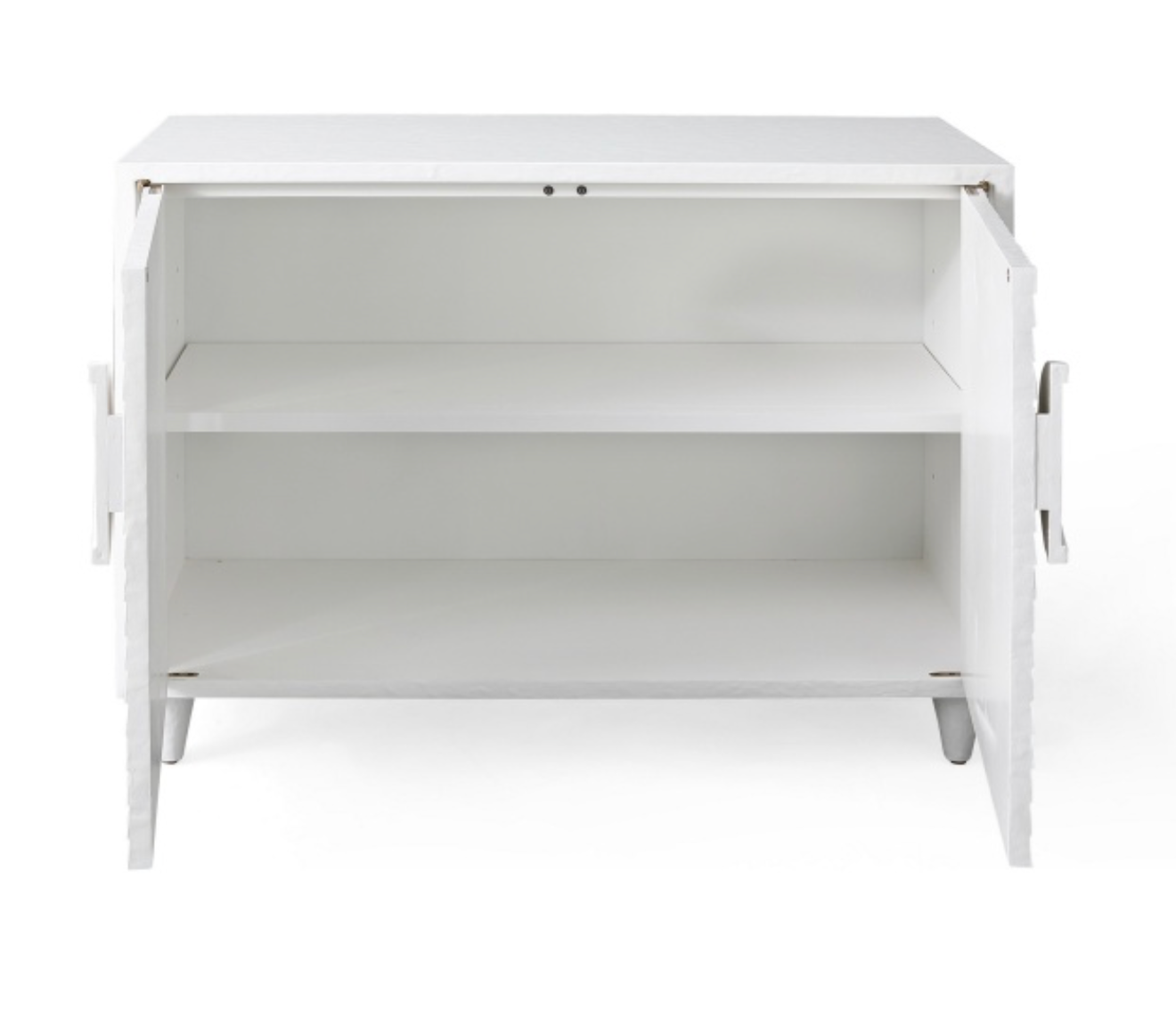 The Lance Cabinet, featuring a pristine white wooden exterior, is shown with its doors open to reveal two internal shelves and a plain design. This hand-crafted piece serves as a minimalist accent, blending seamlessly with modern furniture styles.