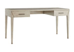 The Dublin Desk is a compact, solid oak desk with a light finish, four tapered legs, and two drawers on each side featuring metal handles.