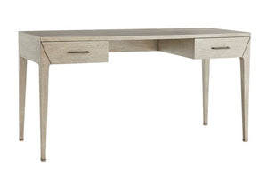 The Dublin Desk is a compact, solid oak desk with a light finish, four tapered legs, and two drawers on each side featuring metal handles.
