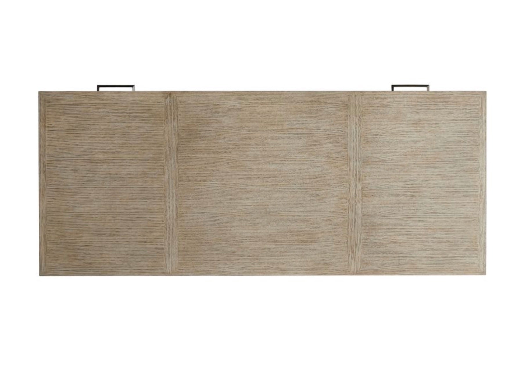 The Dublin Desk is a compact rectangular table made from solid oak, featuring a light textured finish and two visible black handles along the top edge.