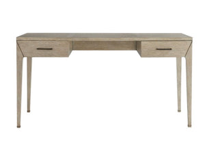 The Dublin Desk is a compact piece made from solid oak, featuring two drawers on each side, tapered legs, and metal handles, displayed against a plain white background.