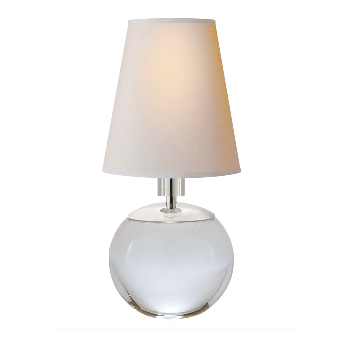 The Tiny Terri Round Accent Lamp features a clear round crystal base and a white cone-shaped fabric shade, casting a petite glow against a plain white background.