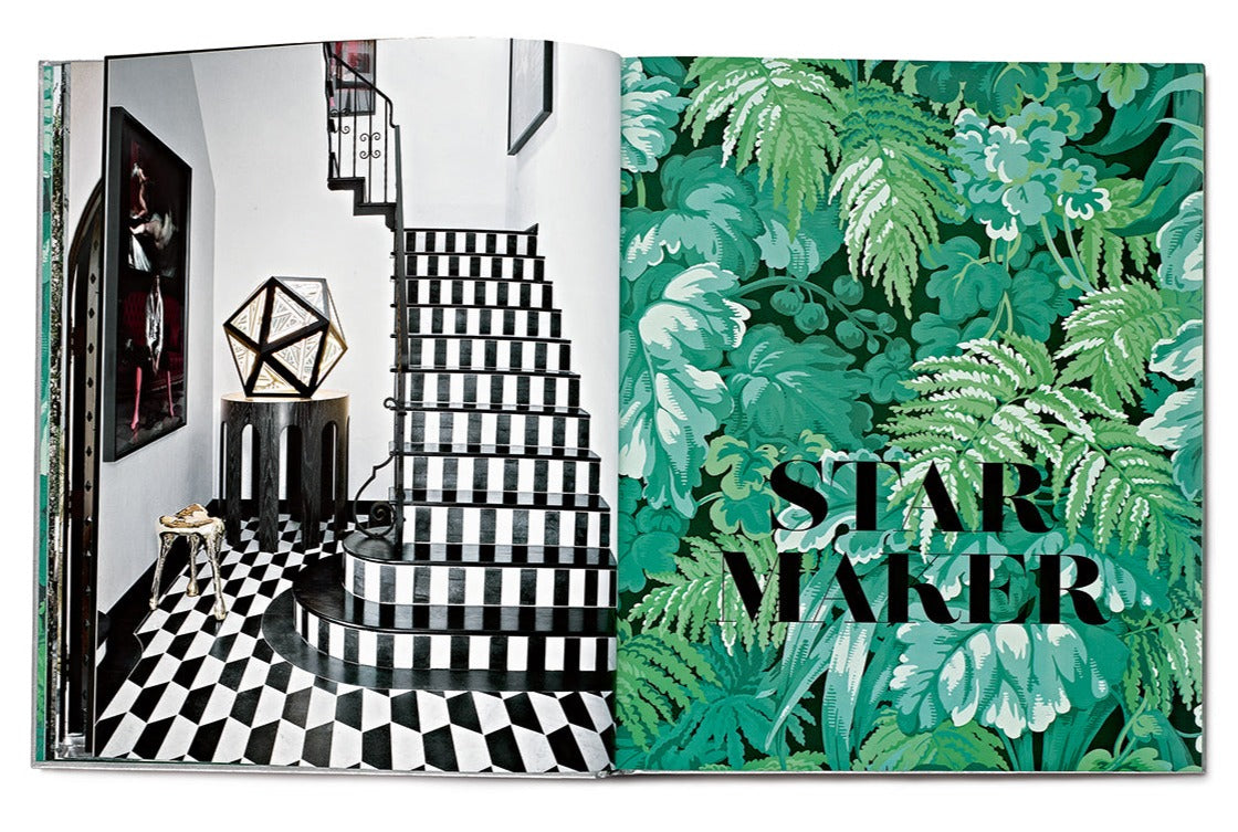 Open book revealing a black and white checkered staircase on the left page, while the right page showcases a green fern-patterned design with the words "STAR STYLE: INTERIORS OF MARTYN LAWRENCE BULLARD," evoking the eclectic interiors Martyn Lawrence Bullard often creates in celebrity homes.