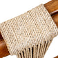 Close-up of a woven natural fiber rope wrapped around a polished wooden frame, showcasing the texture and detailing of the weave on this Strings Attached Lounge Chair.