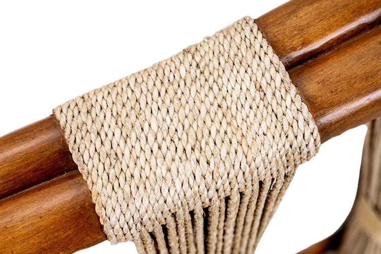 Close-up of a woven natural fiber rope wrapped around a polished wooden frame, showcasing the texture and detailing of the weave on this Strings Attached Lounge Chair.