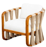 The Strings Attached Lounge Chair is a wooden-framed armchair with a natural finish and a white upholstered seat and backrest. The chair's sides feature decorative rope detailing.