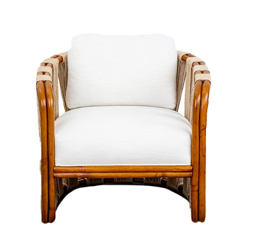 A Strings Attached Lounge Chair with a light-colored cushion and backrest. The chair has a rounded, natural finish frame and woven rattan sides.