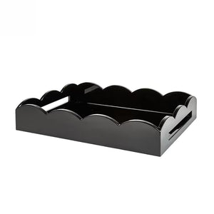 The Scalloped Lacquer Tray in Black, featuring scalloped edges and side handles, is ideal as a drinks tray and is displayed on a white background.