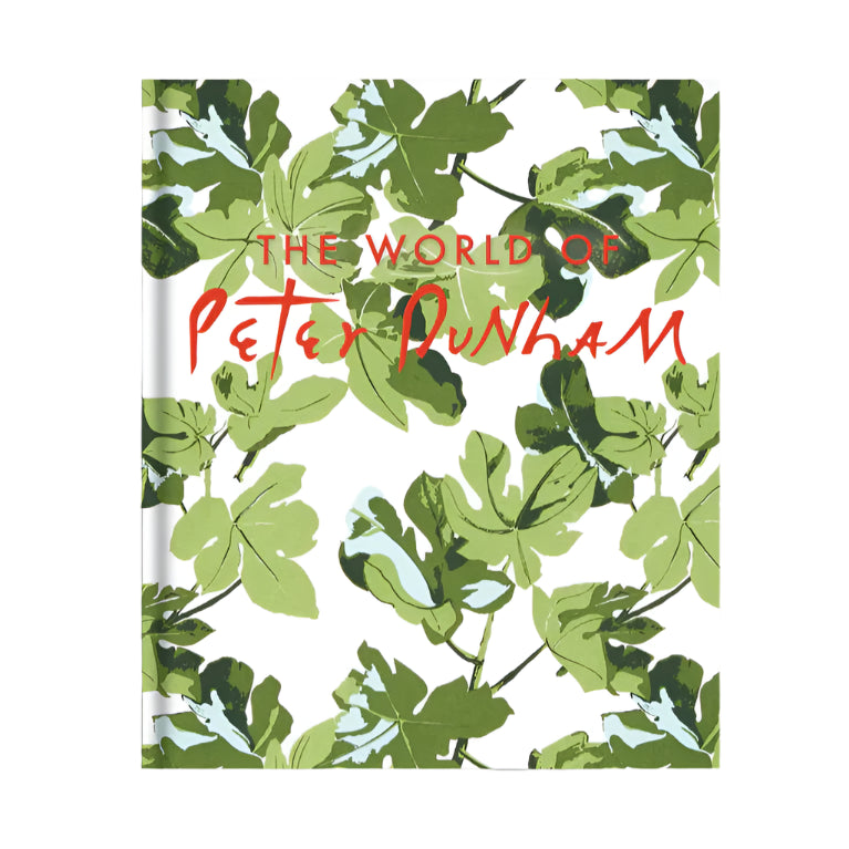Book cover for "The World of Peter Dunham" features green leaves on a white background and red-orange handwritten title, celebrating the globally acclaimed textile designs of interior designer Peter Dunham.