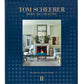 Cover of the book "The Tom Scheerer Compendium," showcasing a stylishly decorated living room with a fireplace and art pieces, set against a blue background. This work exemplifies Tom Scheerer's relaxed modernism, cementing his reputation in American interior design.
