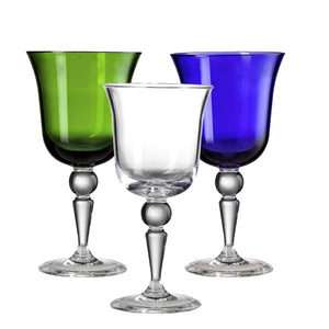 The Mario Luca Giusti St Moritz Acrylic Collection features three vibrant wine glasses with colored bowls—one green, one clear, and one blue—that are elegantly poised on clear stems. This colorful glassware adds a playful touch to any outdoor tablescape.