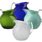 A collection of four Mario Luca Giusti Acrylic Palla Pitchers in green, blue, teal, and white are artfully arranged, showcasing the refreshing new shapes that Mario Luca Giusti is famous for.