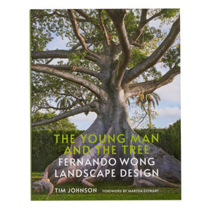 Book cover for "The Young Man and The Tree: Fernando Wong Landscape Design," featuring a large tropical garden-inspired tree. Written by Tim Johnson with a foreword by Martha Stewart.