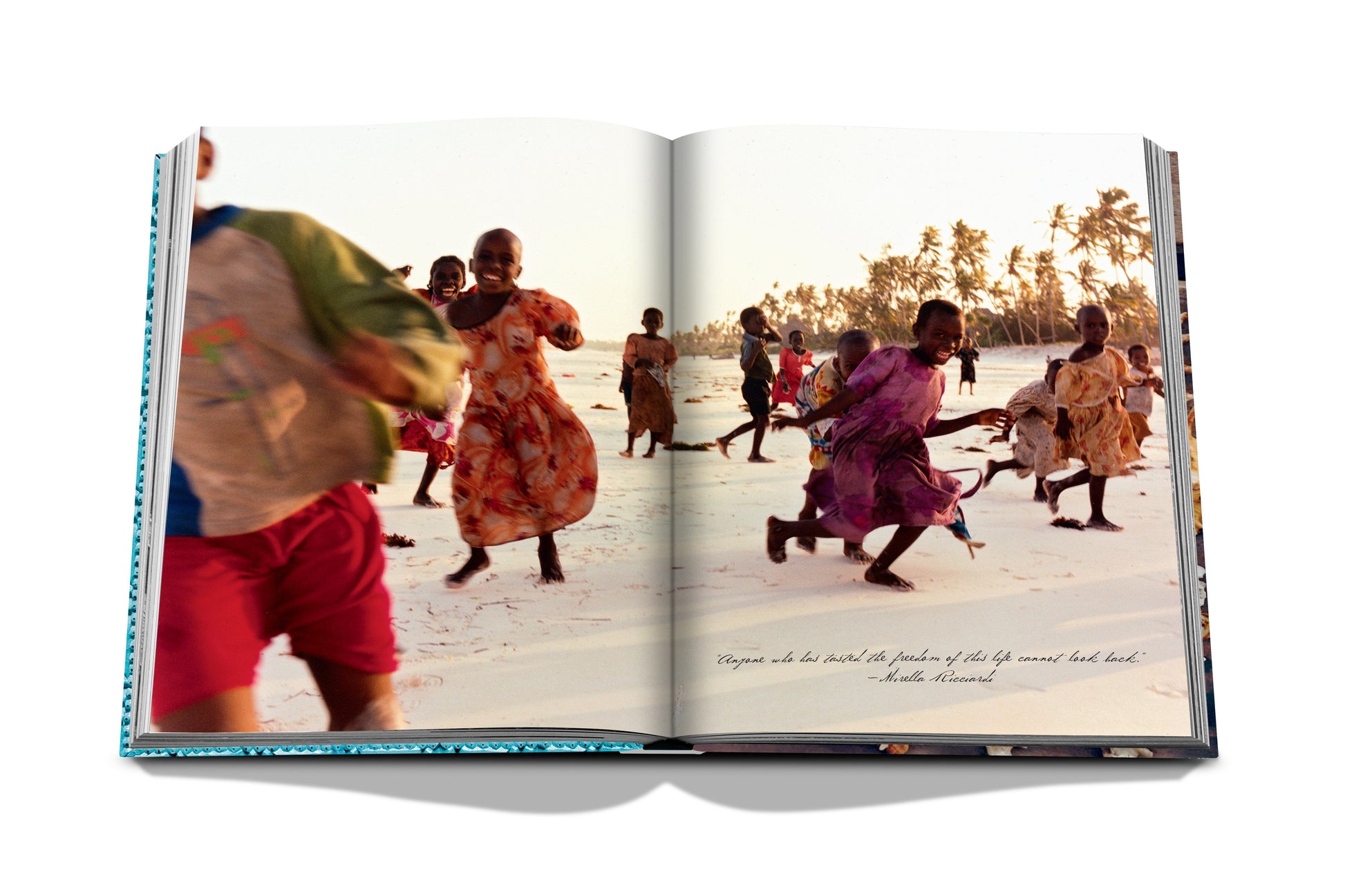 An open Zanzibar reveals a photo of children running on a beach in Zanzibar, with palm trees swaying in the background. Below the photo, an incomplete quote hints at the joy and tradition of Swahili rituals.