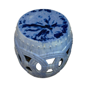 The Large Circle Garden Stool in Blue features a circular top, cut-out decorative patterns, and a glazed finish, evoking an antique look inspired by traditional dragon kiln craftsmanship.