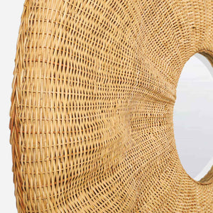 Close-up side view of the Larkin Rattan Mirror featuring a central circular glass and woven rattan frame, set against a white background—an ideal statement wall piece for bohemian-inspired decor.