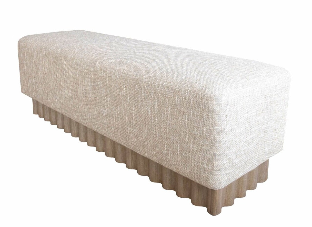 The Aemilius Bench showcases a modernist aesthetic with its corrugated wooden base and cushioned seat covered in beige fabric, adding elements of organic design.