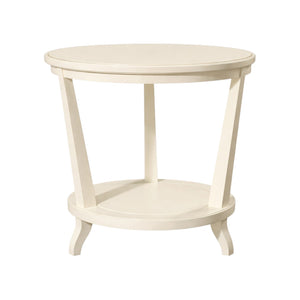The Rye Round Side Table, shown against a white background, showcases an architectural shape in cream-colored wood with tapered legs and a lower shelf.