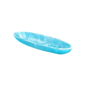 The Nashi Home Serveware Collection, Aqua features a shallow, oval tray made from light blue marbled resinware—perfect as a unique serving piece or accent for your decor. Displayed on a white background.