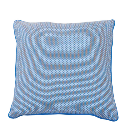 Arles Paon Outdoor Pillow in a square shape, featuring blue and white textured fabric with blue piping, shown against a white background.