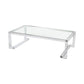 The Ava Cocktail Table features a clear rectangular glass top and a modern, geometric metal frame, photographed on a white background—this sleek cocktail table brings a contemporary touch to any living space.