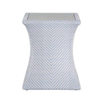 The Bari Square End Table in Chambray features a weather-resistant porcelain hourglass shape with a chevron-patterned light blue and white surface, shown against a white background.