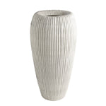 The Baleen Ivory Vase is a tall, cylindrical white Italian ceramic vase with ribbed details, inspired by baleen whales, shown upright against a plain white background.
