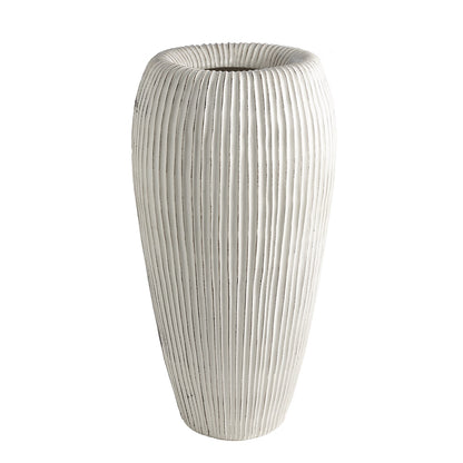 The Baleen Ivory Vase is a tall, cylindrical white Italian ceramic vase with ribbed details, inspired by baleen whales, shown upright against a plain white background.
