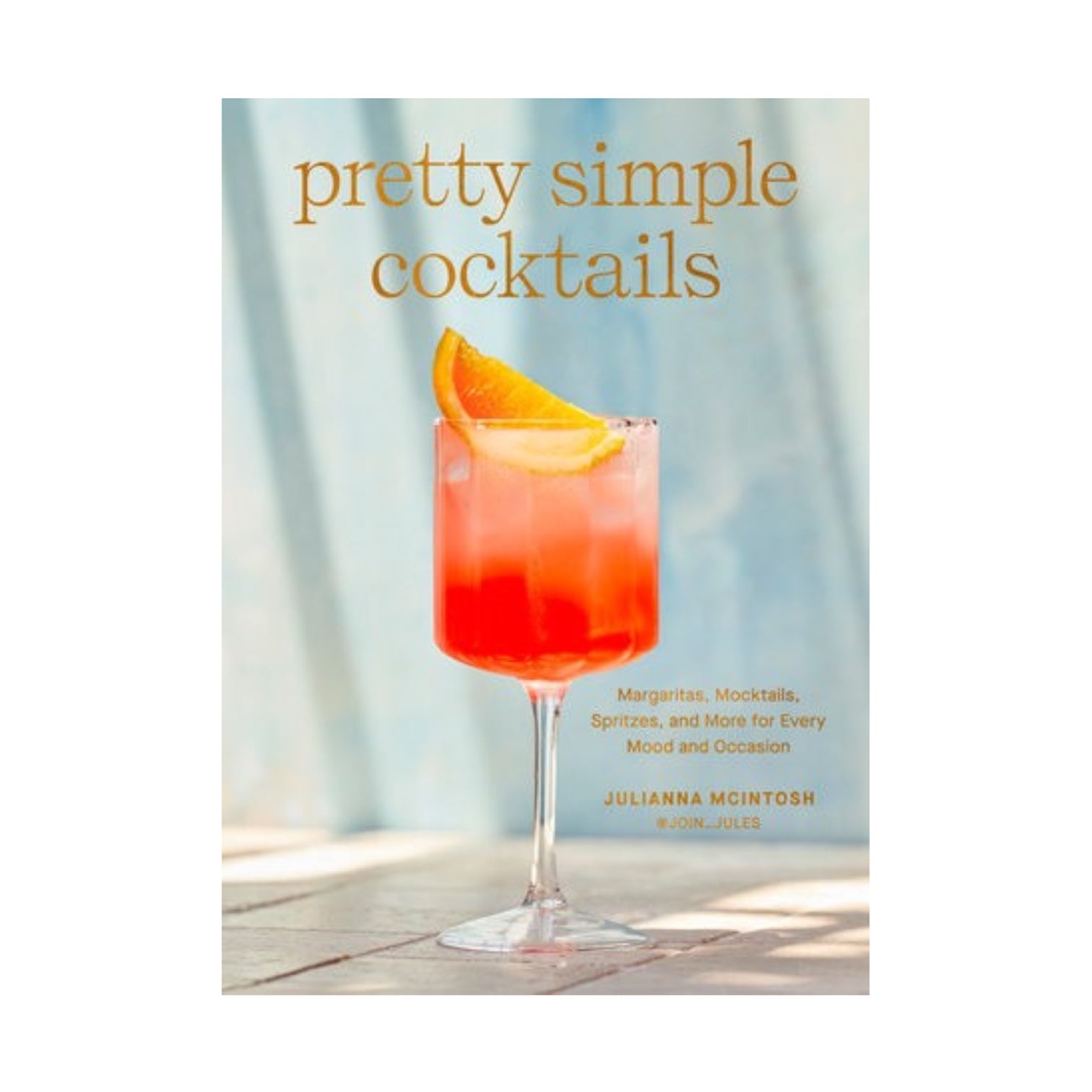 The "Pretty Simple Cocktails" book cover shows a stemmed glass with an orange-red drink, garnished with an orange slice, set against a light blue background—ideal for home mixologists wanting easy cocktail recipes.