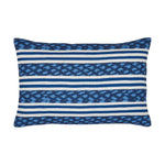 The Banita Outdoor Lumbar Pillow showcases horizontal stripes in varying shades of blue and white, accented by geometric patterns woven into weather-resistant fabric.
