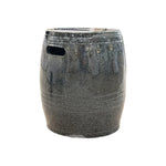 The Feathered Grey Barrel Stool is crafted from quality porcelain with a glossy finish, rounded barrel shape, and two rectangular side handles, shown isolated on a white background.