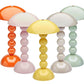 Five Addison Ross Bobbin LED Cordless Lamps, each in orange, yellow, white, light pink, and light green, feature dome-shaped shades and rounded bobbin-style bases. Portable and stylish, they are arranged close together.