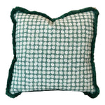 The Boheme Green Outdoor Pillow features a green and white circular pattern, dark green textured edges, and slightly puckered corners, making it a striking luxury accent for any space.
