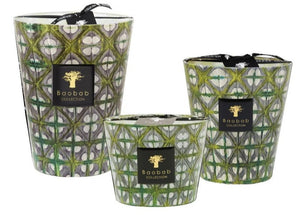 Three Baobab Collection Bohomania Lazlo Candles of varying sizes, each in green geometric-patterned holders with a Baobab Collection label and ribbon.