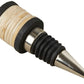 A bottle stopper from the Be Home Black Mango Wood & Rattan Bar Accessories Collection with a mango wood handle.