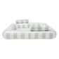 Rectangular inflatable pool with light green and white stripes, featuring two cylindrical headrests for luxury relaxation. For ultimate comfort, pair it with the SUNNYLiFE Luxe Twin Hammock Float.