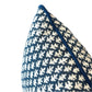 Close-up of the Burma Indigo Outdoor Lumbar Pillow, featuring a blue and white patterned fabric with piped edges, displayed against a plain white background.