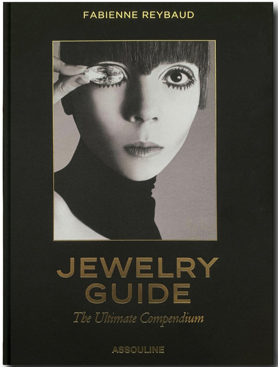 A book cover titled *Jewelry Guide: The Ultimate Compendium* by Fabienne Reybaud, featuring a black and white close-up photo of a woman holding a jewel over her eye.