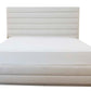 A neatly made custom bed with a white padded headboard featuring channeled detailing and matching white bedding. The Channel Bed, King has horizontal lines.