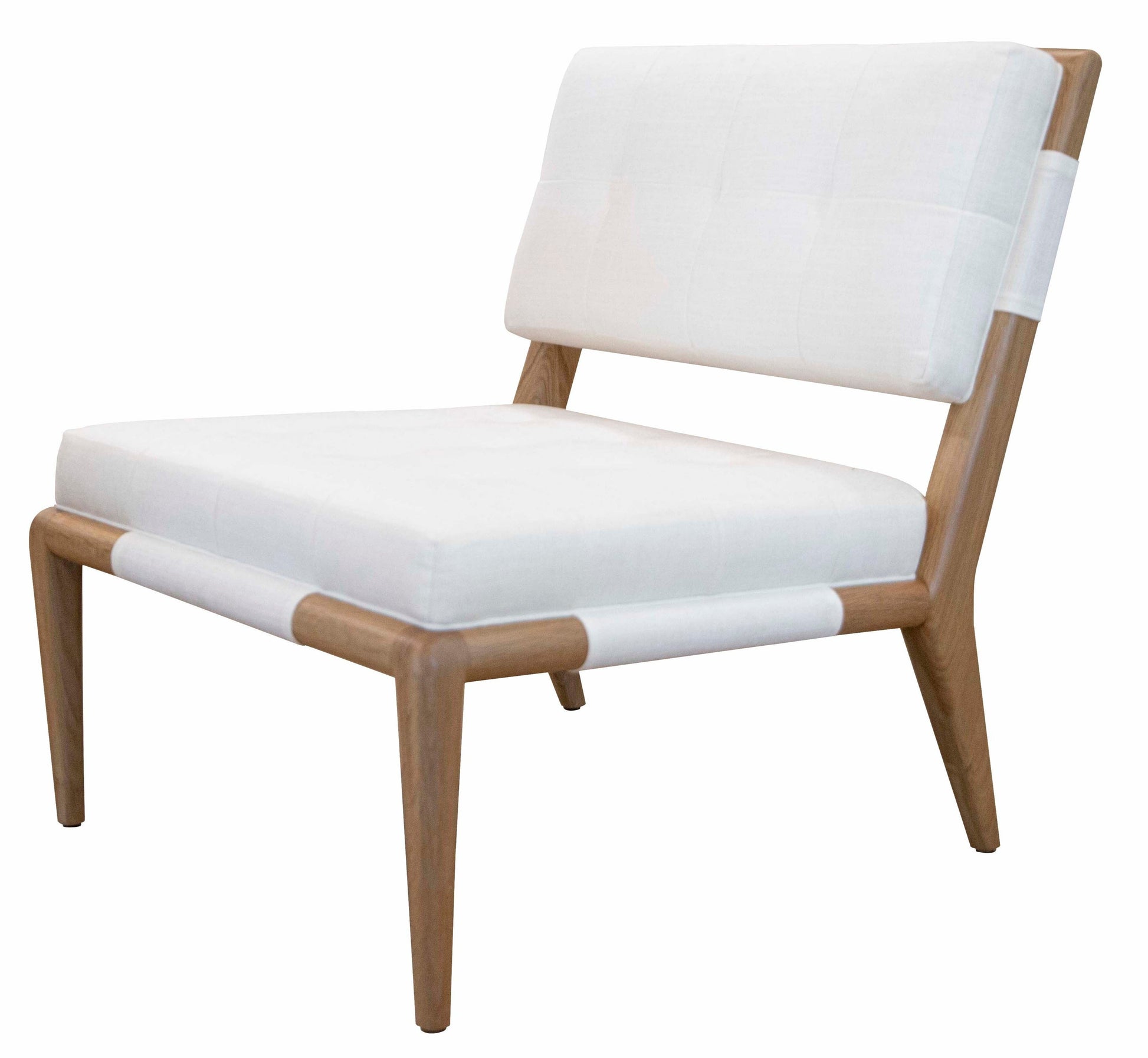 A Chatfield Armless Chair with a white cushioned seat and backrest. The chair has a minimalist design, blending classic simplicity with modern flair, featuring clean lines and a light wood finish.