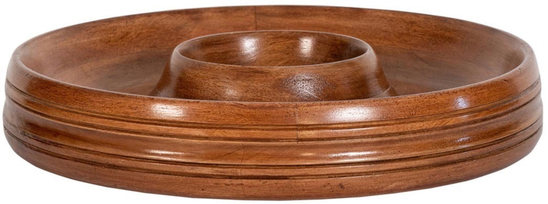 A round serving tray crafted from mango wood, featuring a raised central compartment, part of the exquisite Juliska Bilbao Wood Serving Collection.