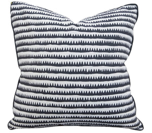 A Corfu Stripe Pillow with a black and white zigzag pattern, crafted from the finest materials with special attention to detail.