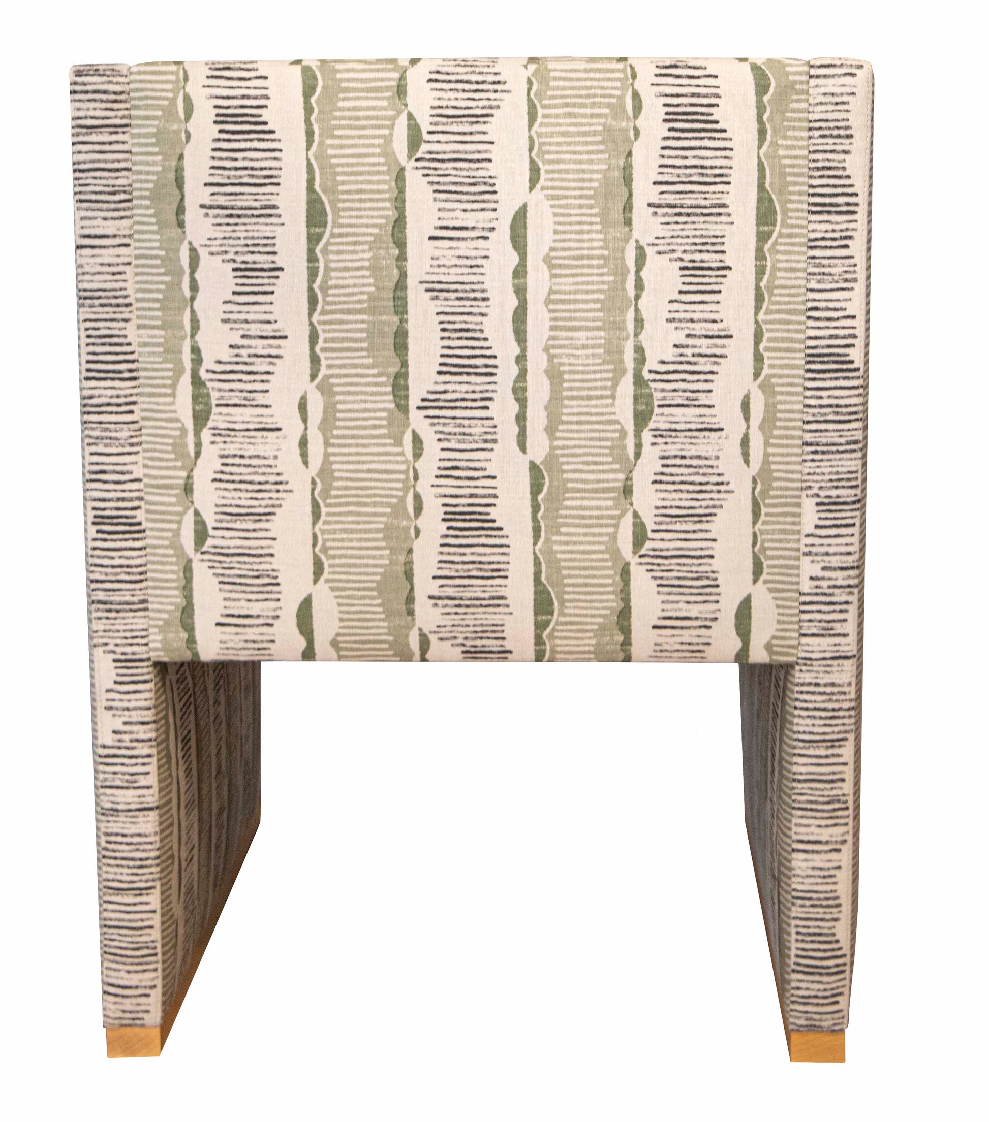 A Dune Dining Chair in bleached walnut with a patterned fabric design featuring vertical stripes in shades of green, gray, and beige. The chair's boxy shape and clean lines evoke an easygoing elegance, blending perfectly into a modern organic style with no visible arms.